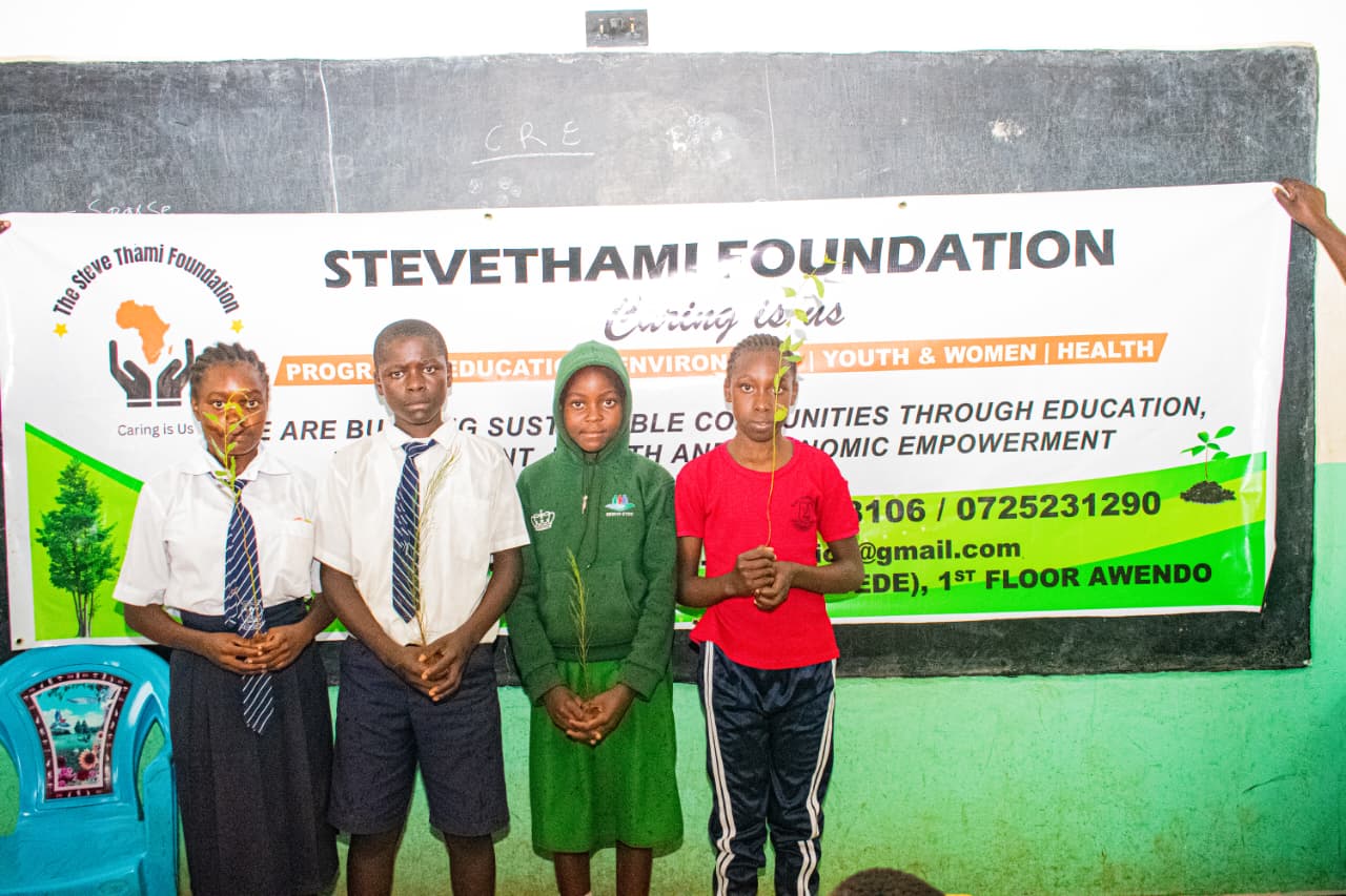 Steve Thami Foundation leader with students at award ceremony in Kenya